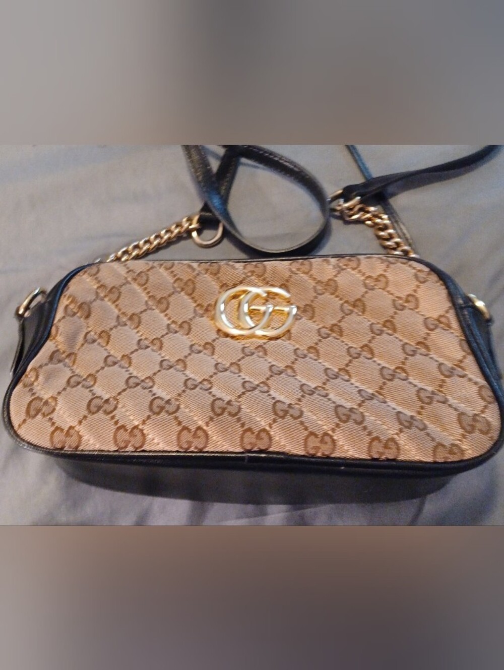Vintage Gucci beige marmot crossbody bag in quilted monogram.